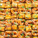 Teriyaki Shrimp and Pineapple Skewers on a sheet pan.