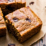 Pumpkin Chocolate Chunk Cake square slice on parchment paper.