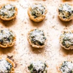 Spinach Artichoke Dip Phyllo Cups on sheet pan.