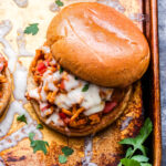 Italian Sloppy Joe sandwich on a sheet pan topped with melted mozzarella cheese.