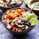 Chili Lime Chicken Burrito Bowl with sweet potatoes, black beans, rice and topped with avocado sauce.
