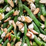 closeup photo of Green Bean Salad with Feta and sliced almonds.