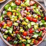 black bean and corn salsa salad in a white serving bowl.