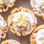 Overhead closeup of a Mini Lemon Cream Pie in a phyllo cup topped with whipped cream.