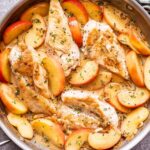 stainless steel skillet with Apple cider chicken in it.