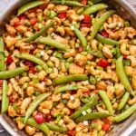 Cashew Chicken Stir Fry in a stainless steel skillet