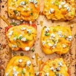 6 Buffalo chicken stuffed peppers on a sheet pan.