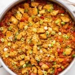 Cajun Chicken and Rice in a stainless steel skillet.
