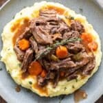 Braised short ribs on top of mashed potatoes.