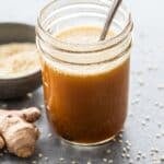 Sesame Vinaigrette in a jar with a spoon.
