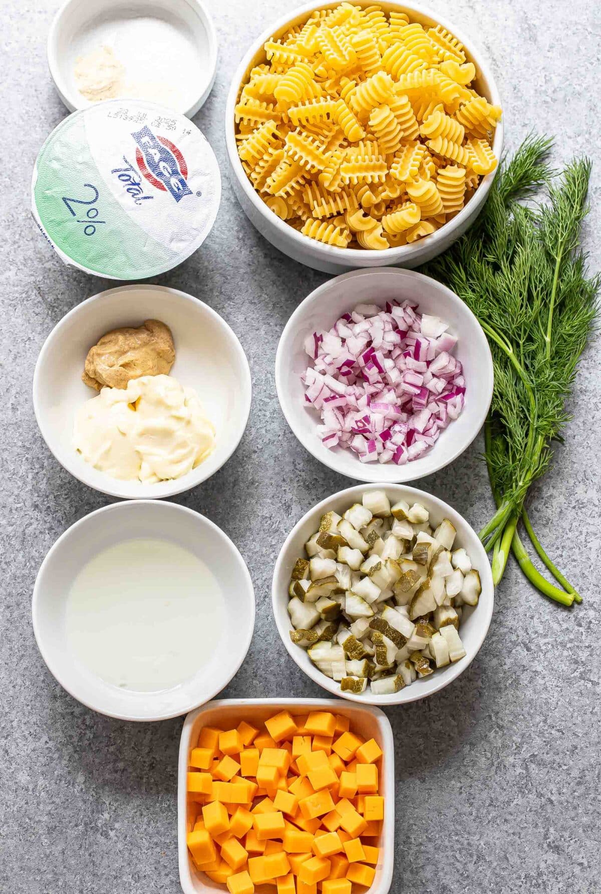 Ingredients used to make dill pickle pasta salad.