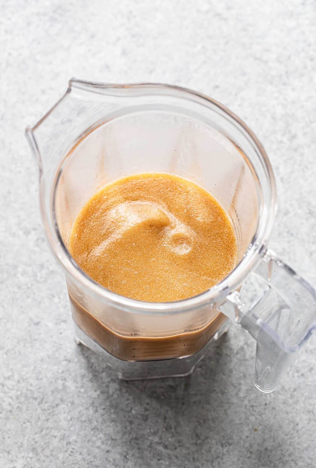 Frozen espresso martini in a blender jar.