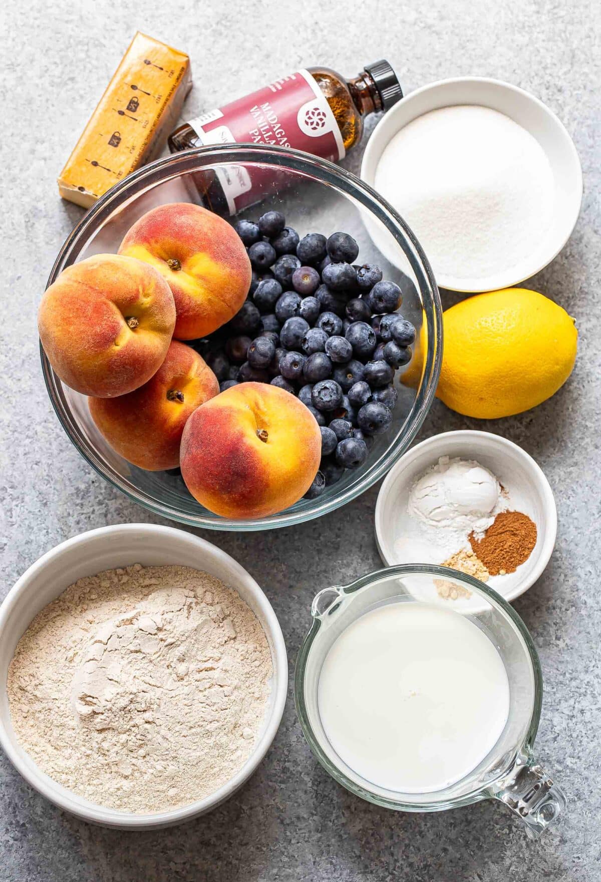 Ingredients used to make blueberry peach cobbler.