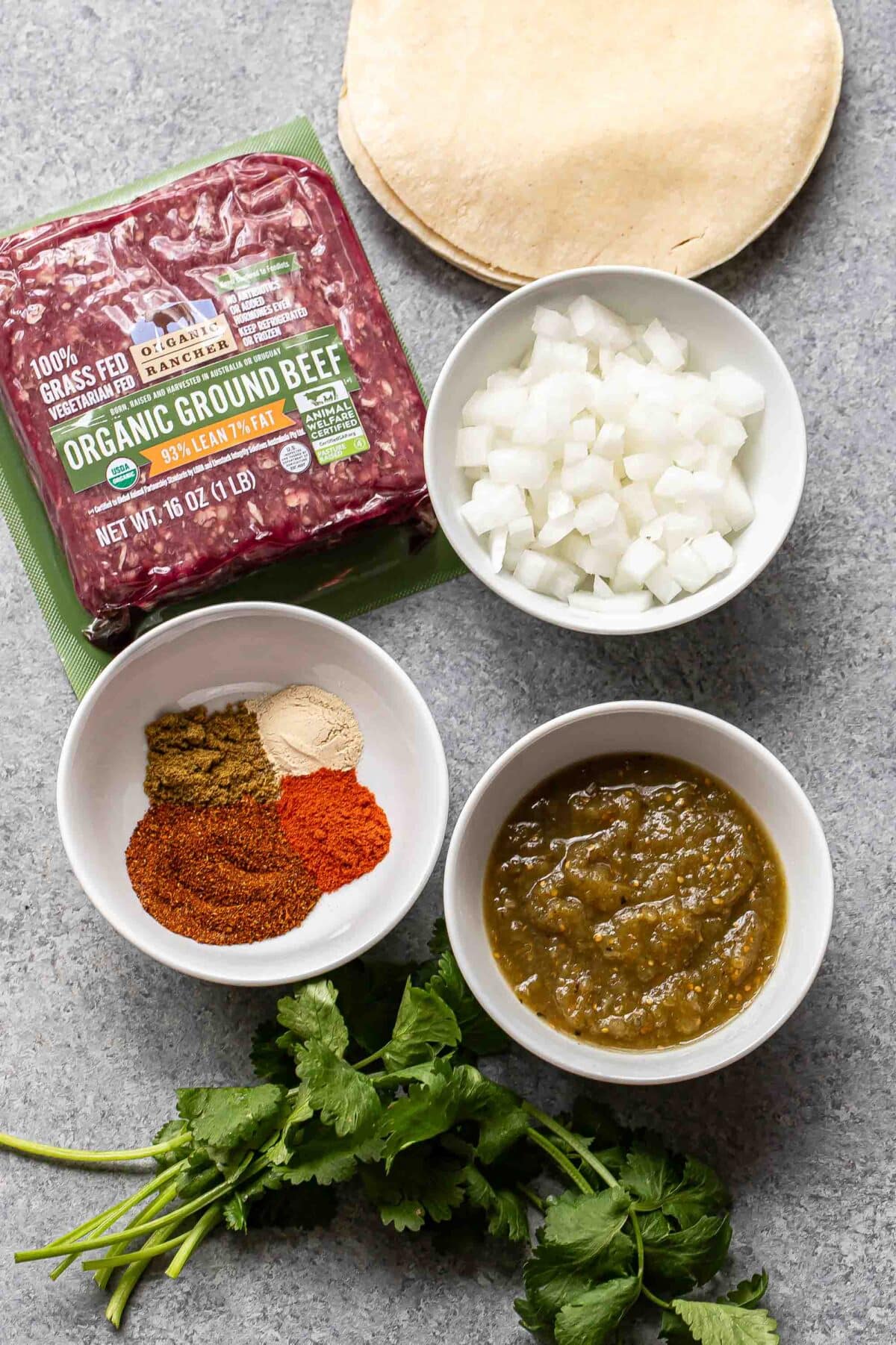 Ingredients used to make ground beef tacos.