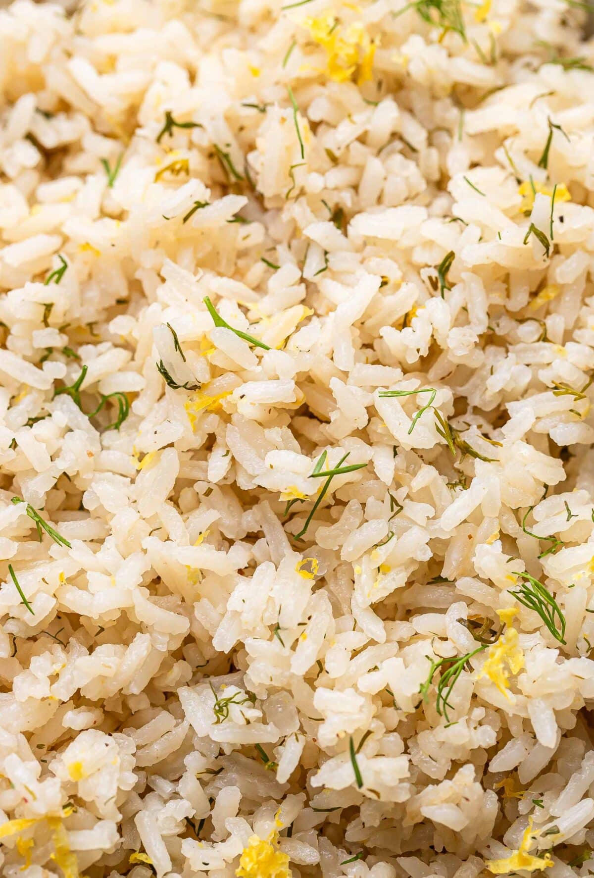Lemon dill rice with lemon zest and fresh dill on top.