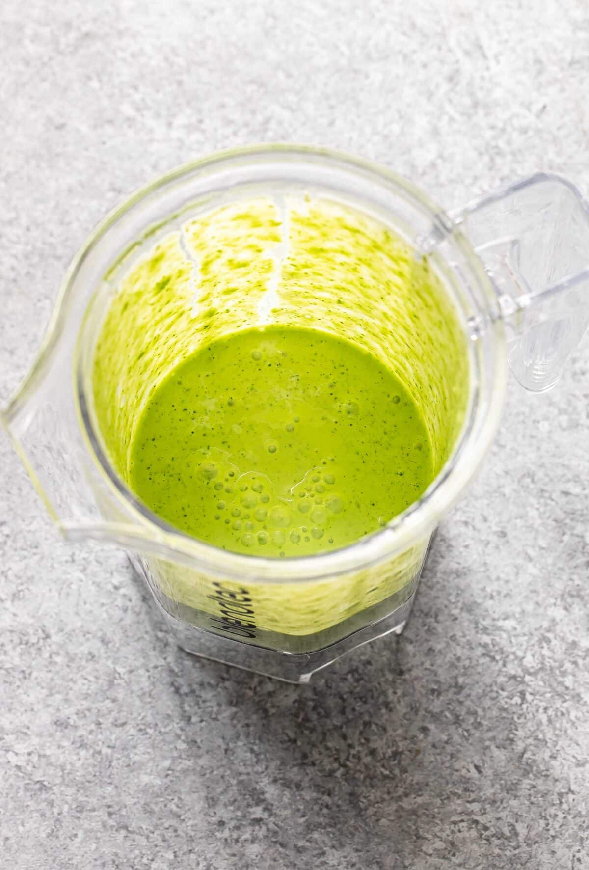 Cilantro lime dressing in a blender jar.