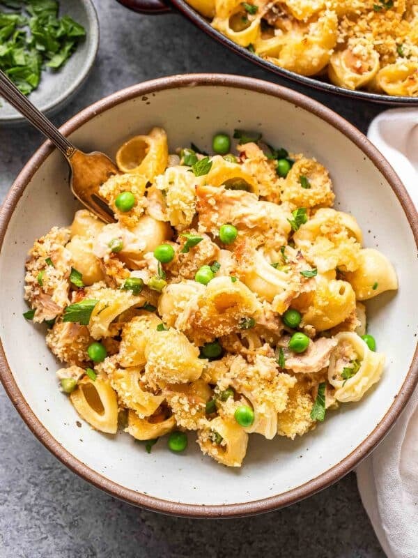 Tuna casserole in a white bowl with a fork.