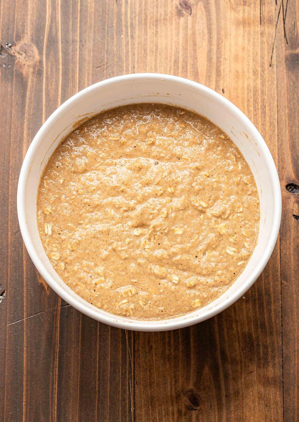 applesauce muffin batter in a white mixing bowl.