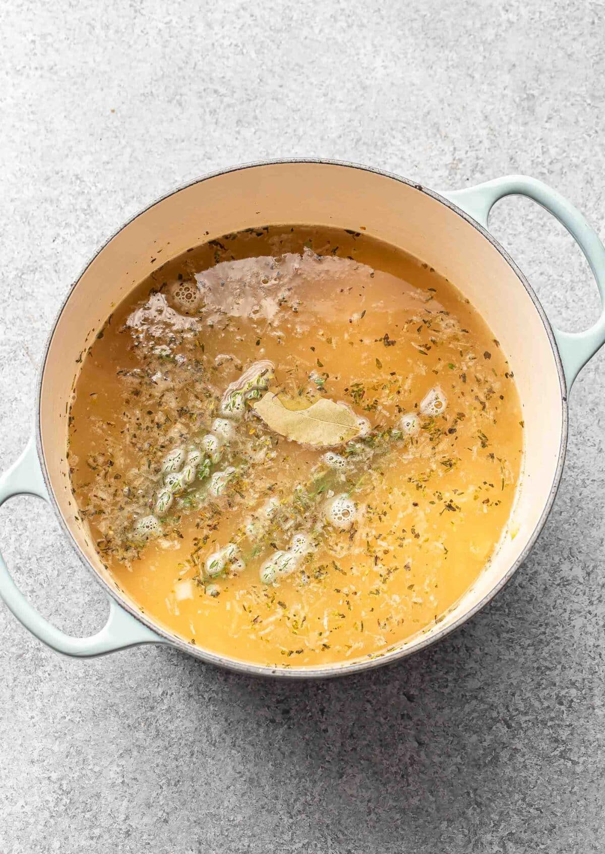 Chicken and rice soup in a pot.