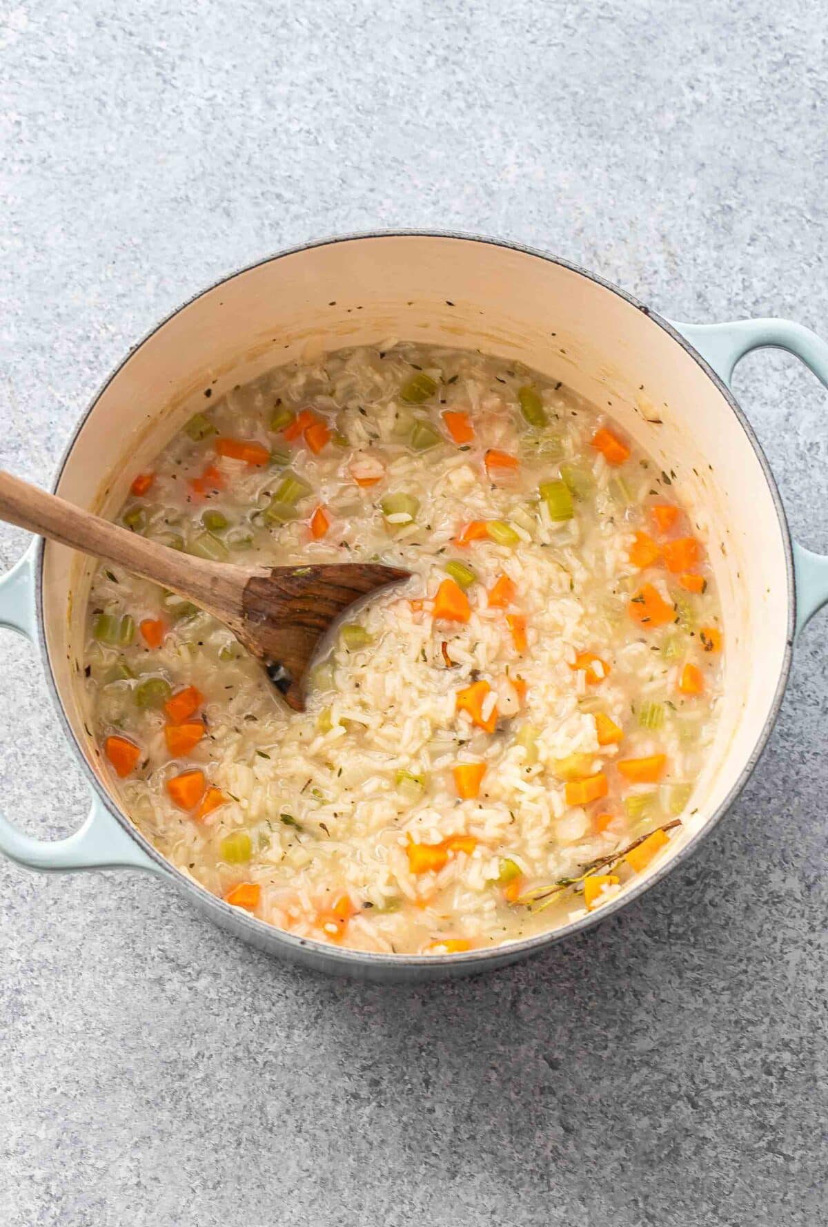 Chicken and rice soup in a pot after the rice is cooked.