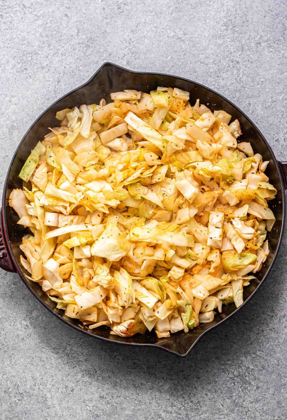 Sauteed cabbage in a skillet.