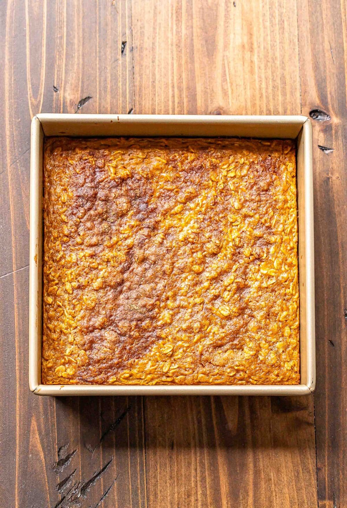 Pumpkin baked oatmeal topped with cinnamon sugar in an square baking pan