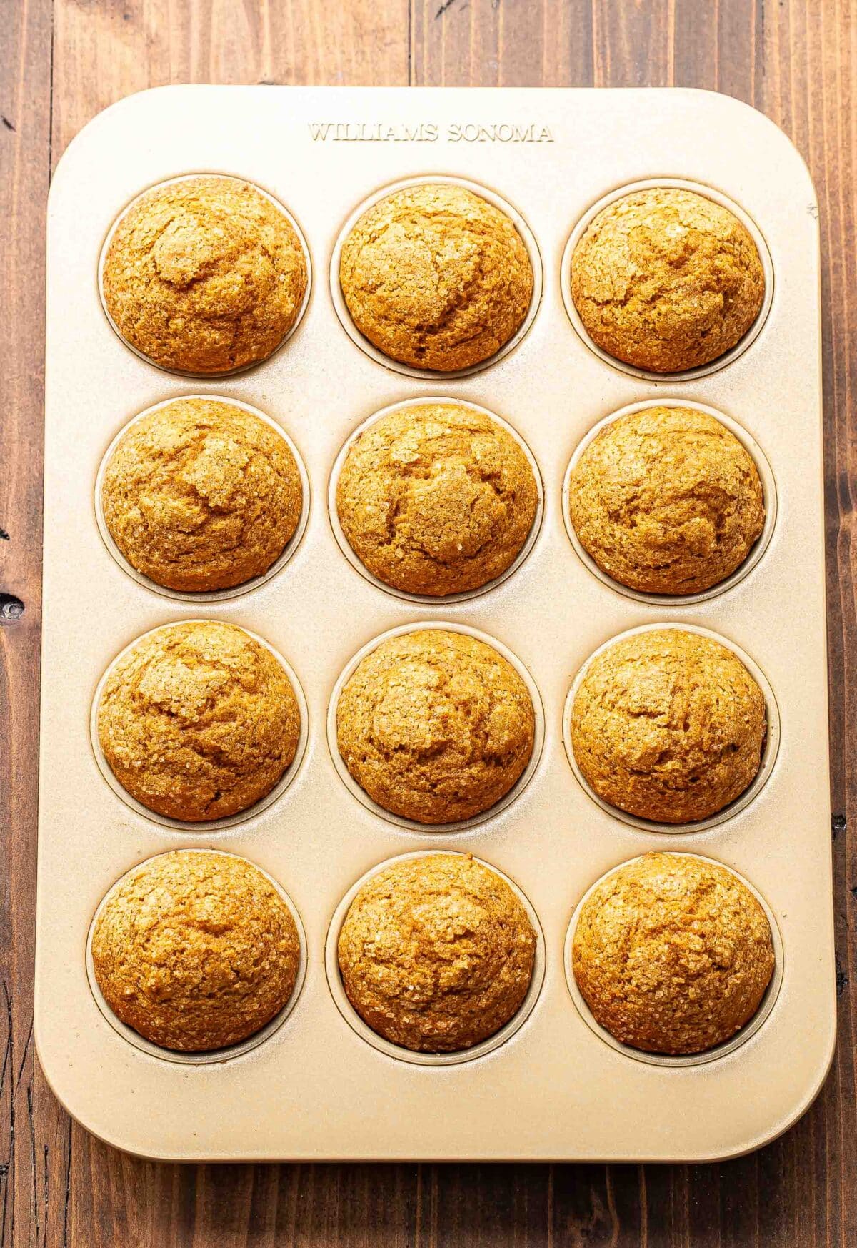Pumpkin muffins in a muffin pan.