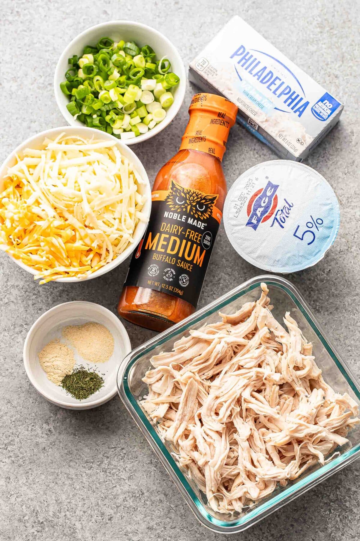 Ingredients used to make buffalo chicken dip.