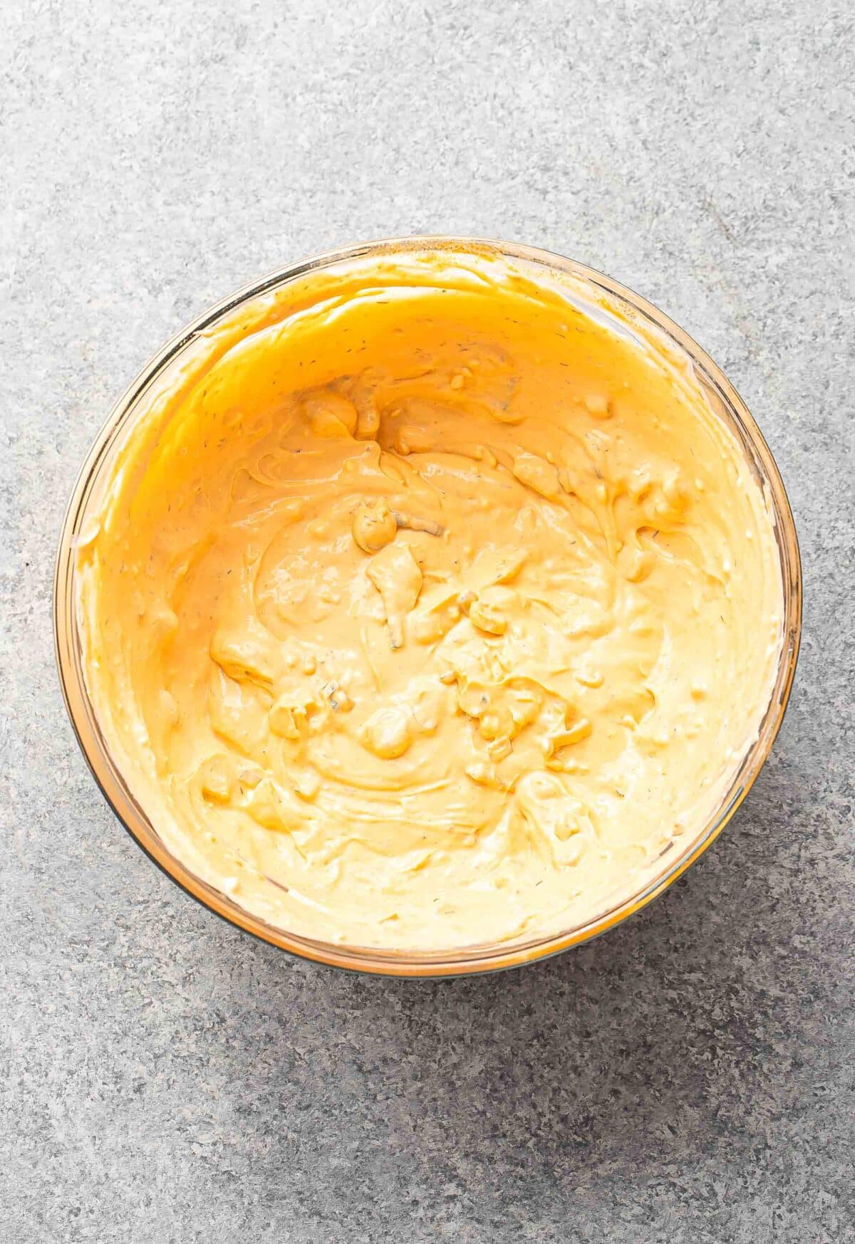 Buffalo chicken dip in a glass mixing bowl.