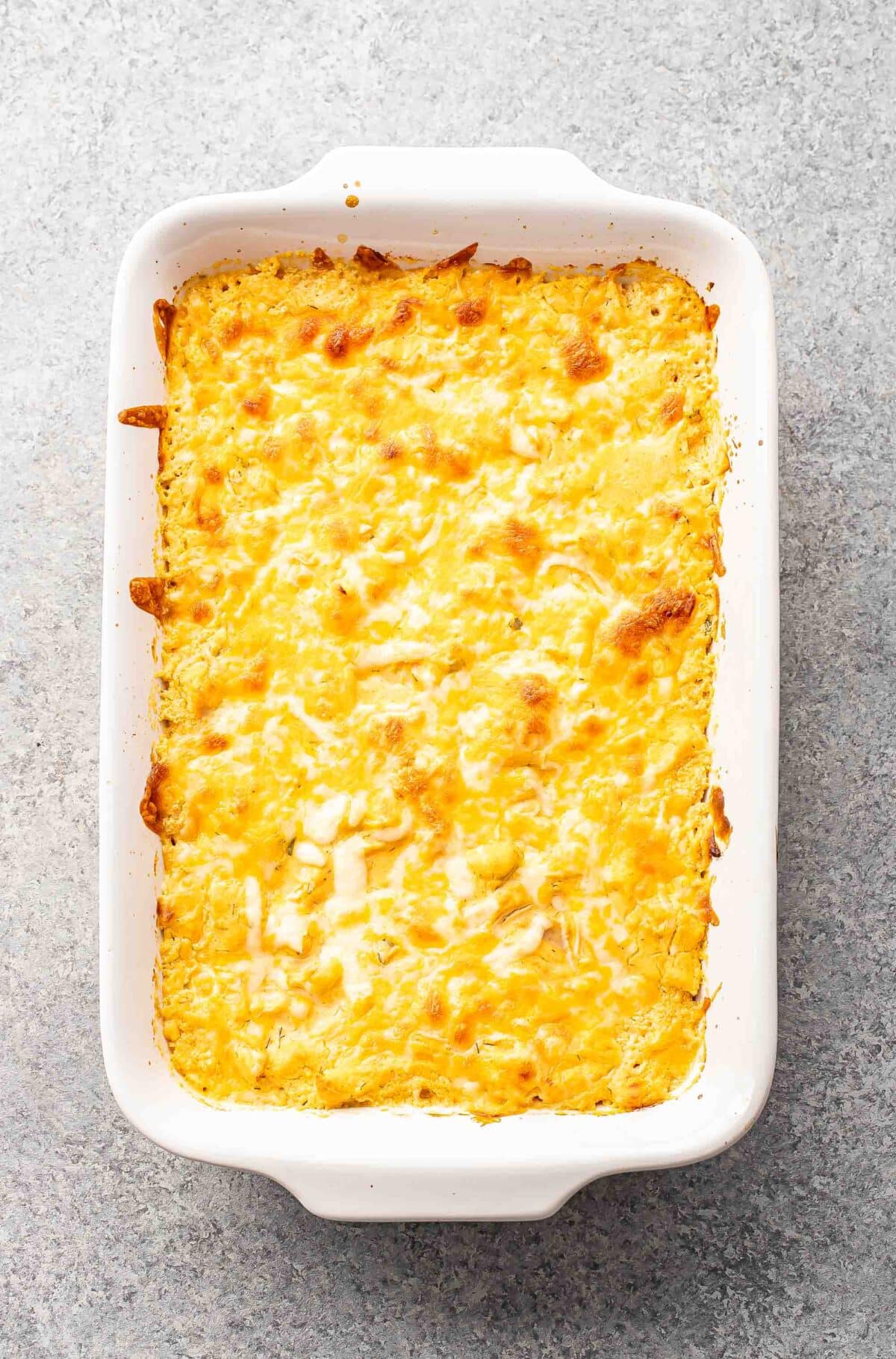 Buffalo chicken dip in a rectangular casserole dish.