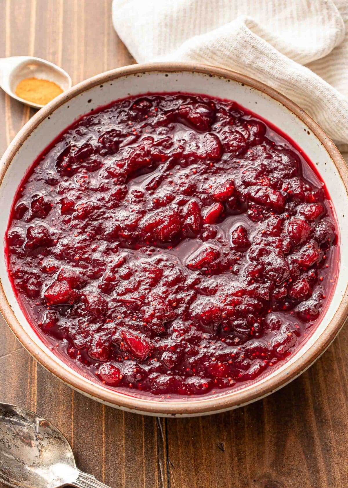 Cranberry sauce in a white serving bowl.