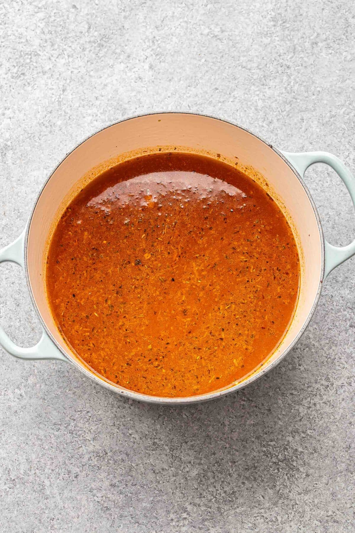 Soup broth in a pot.