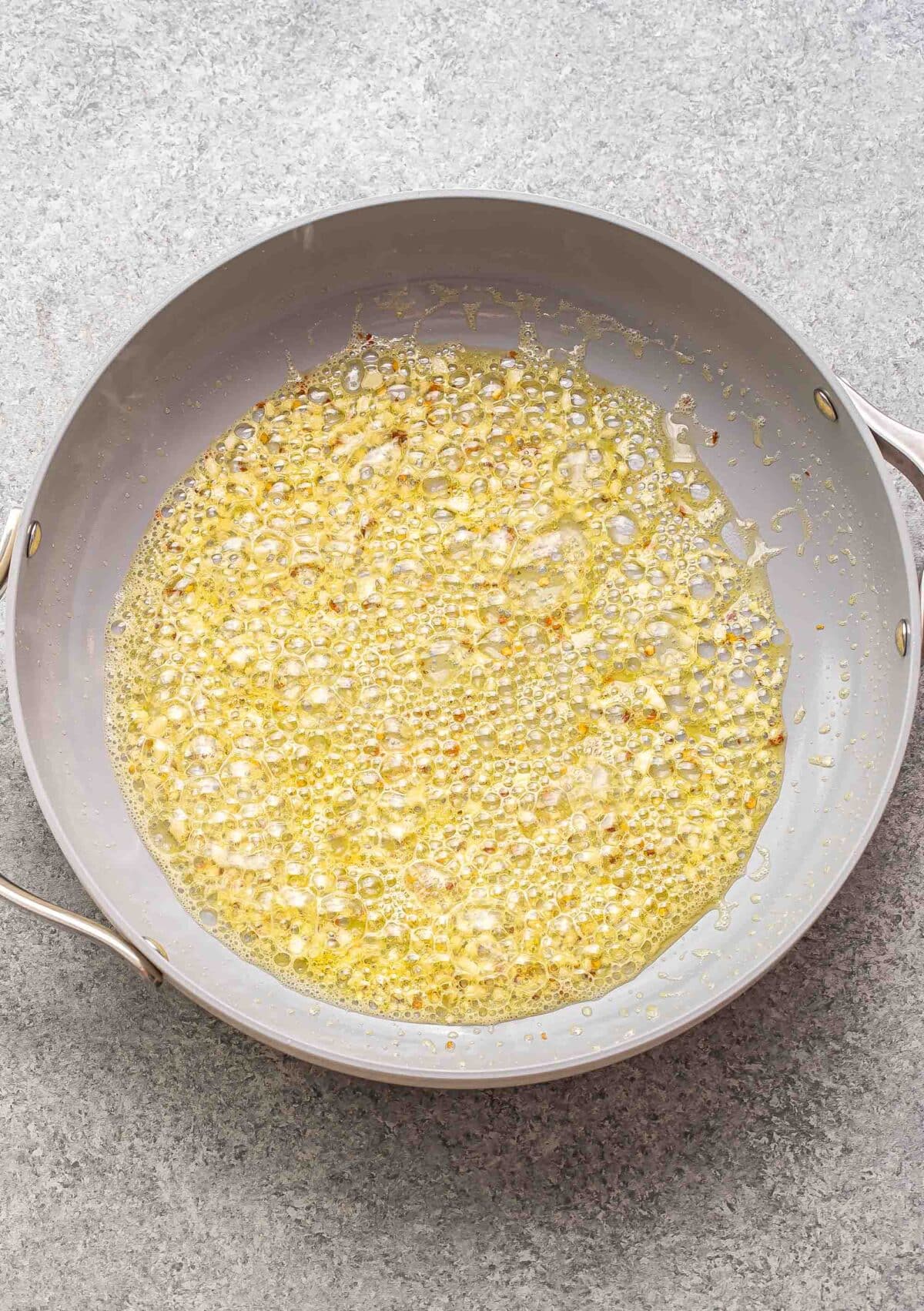 Butter and garlic in a skillet.