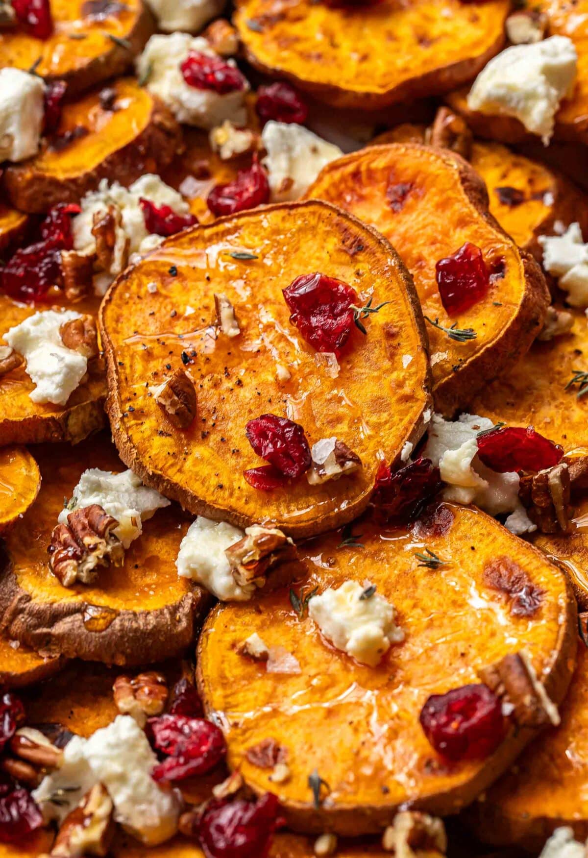 Sweet potato rounds with crumbled goat cheese, dried cranberries, and pecans.