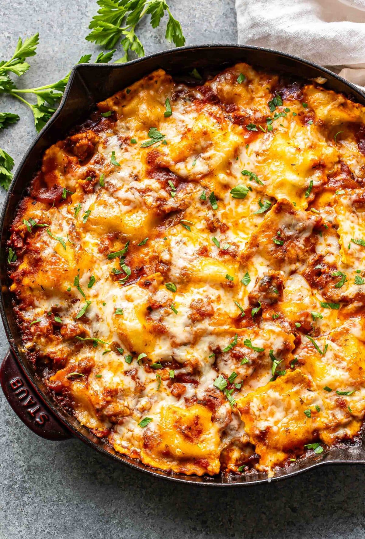 Baked ravioli in a skillet.