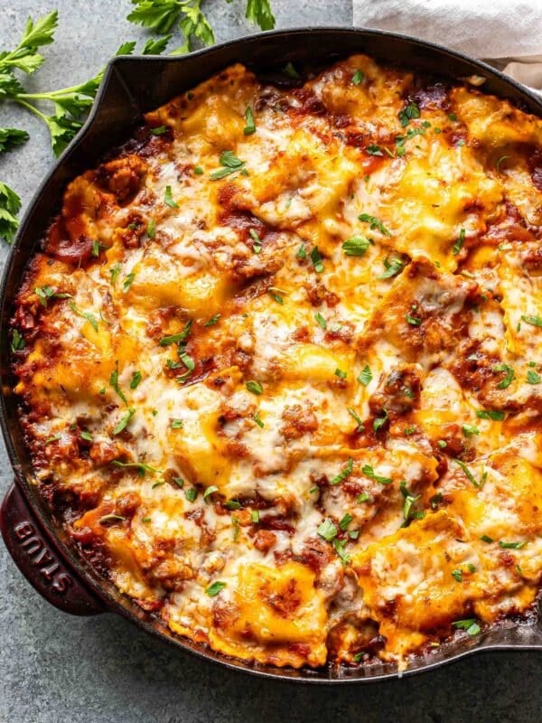 Baked ravioli in a skillet.