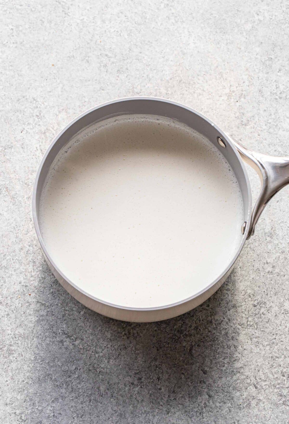 Milk and rice in a saucepan.