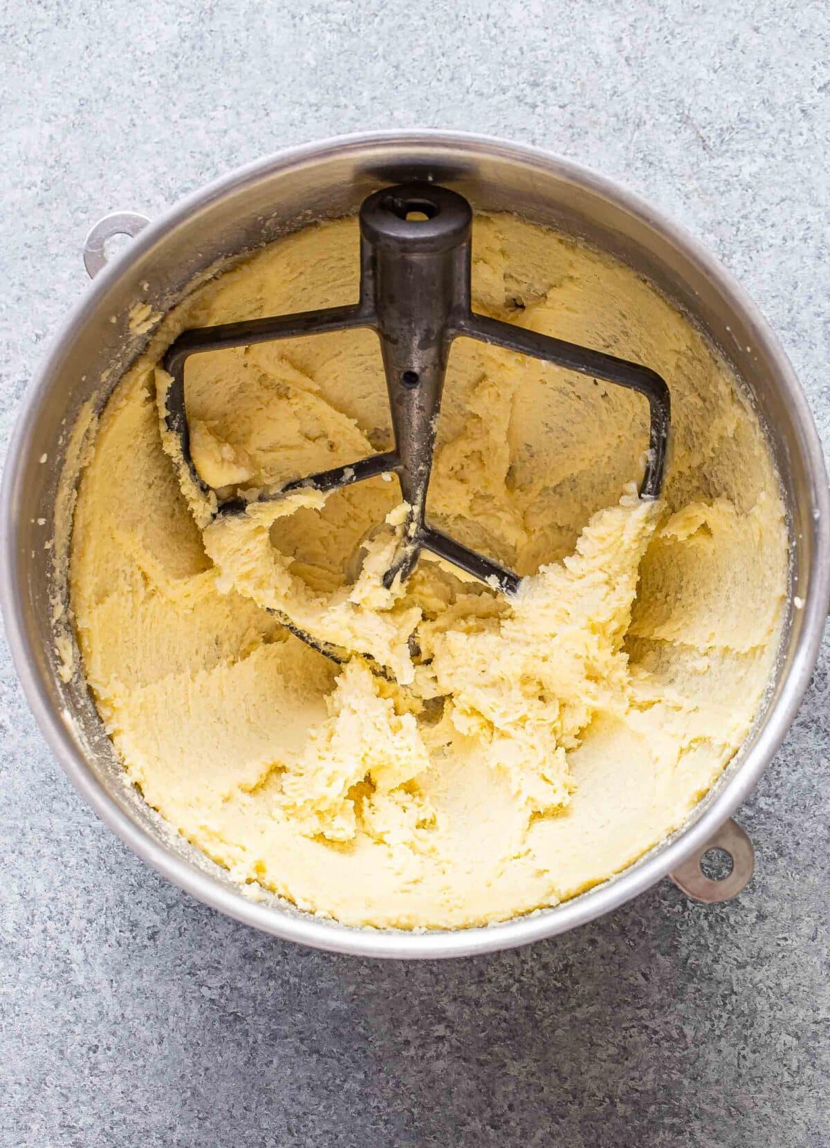 Butter and sugar beaten together in a mixing bowl.