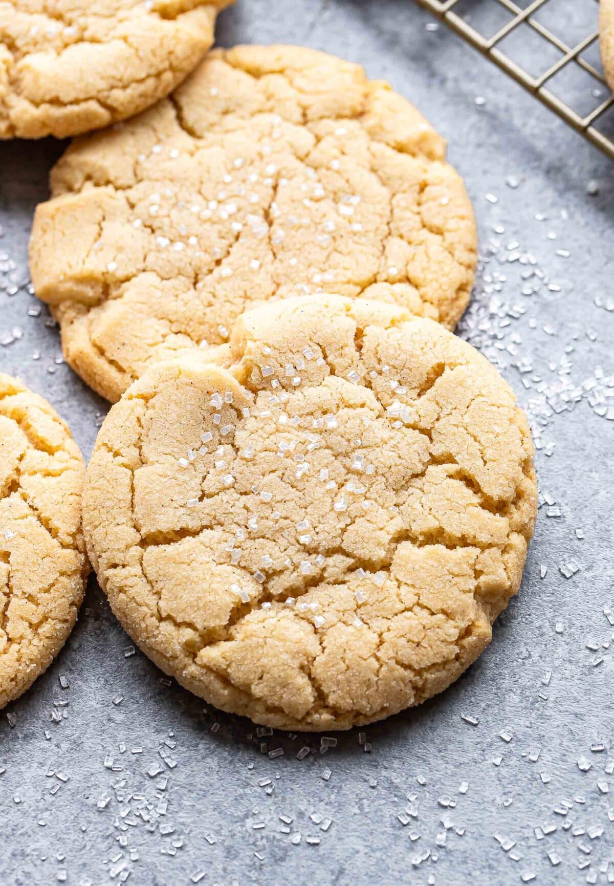 Two soft and chewy sugar cookies resting on each other.