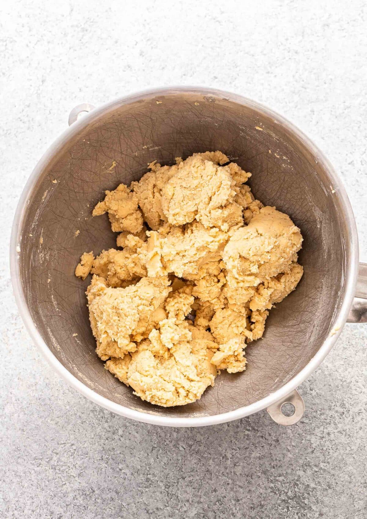 Sugar cookie dough in a mixing bowl.