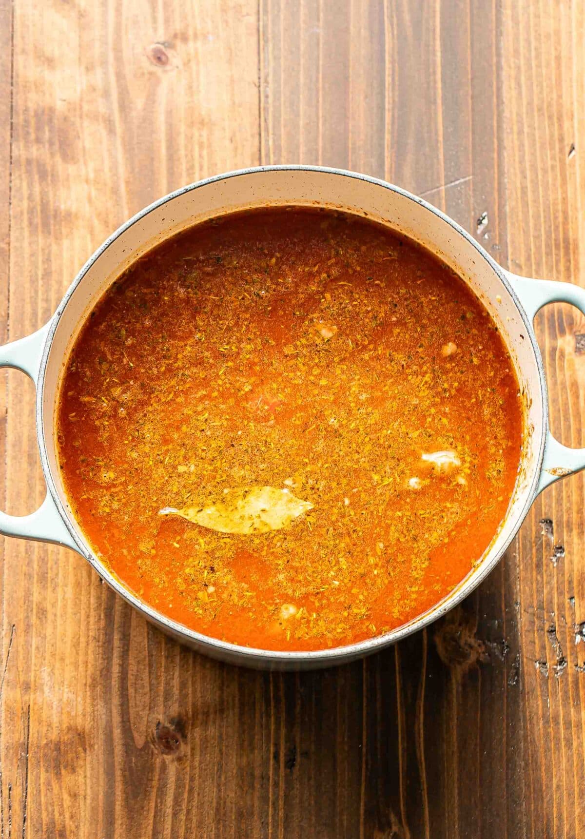 Beef vegetable soup in a pot before it's cooked.