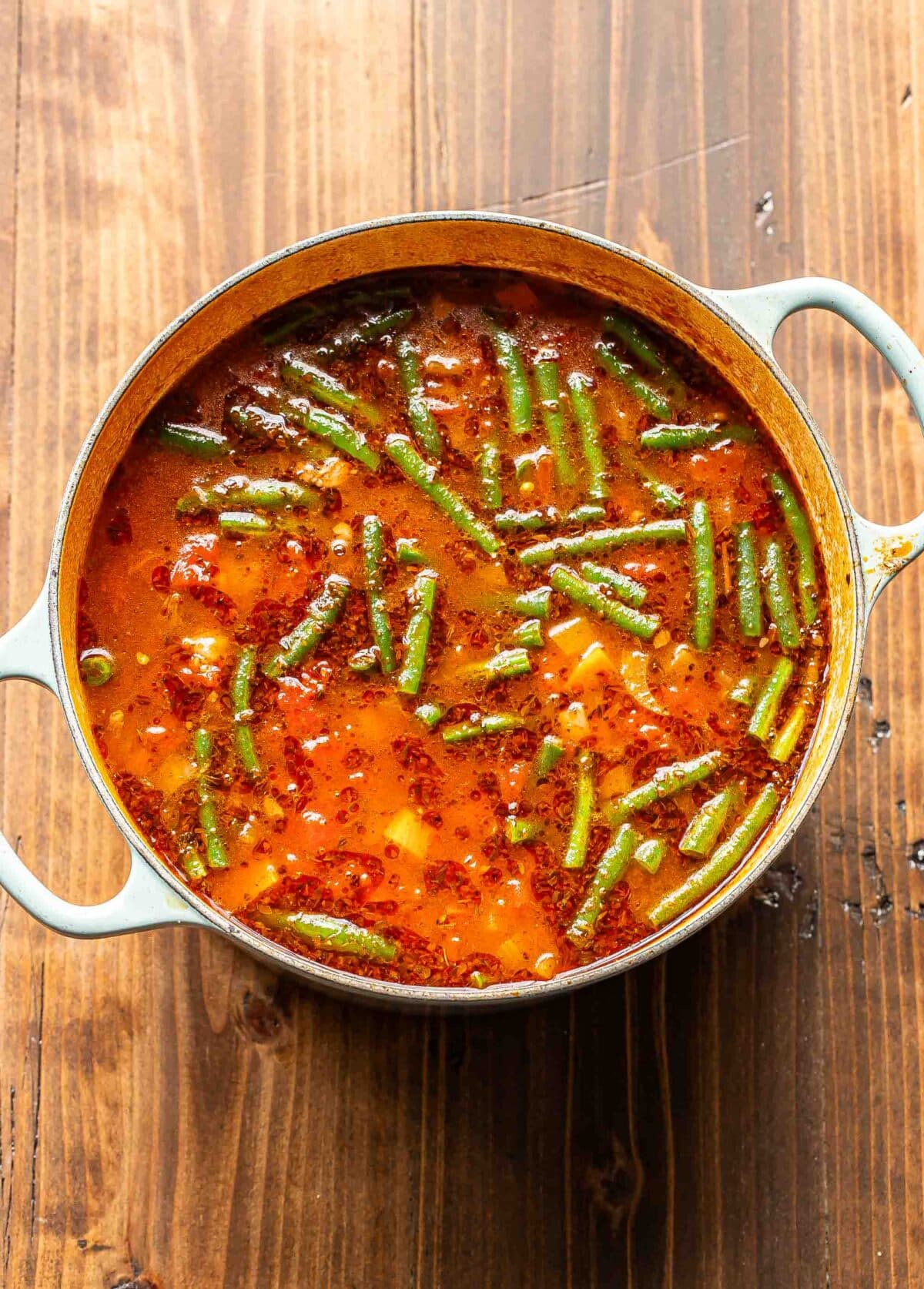 Beef and vegetable soup in a pot.