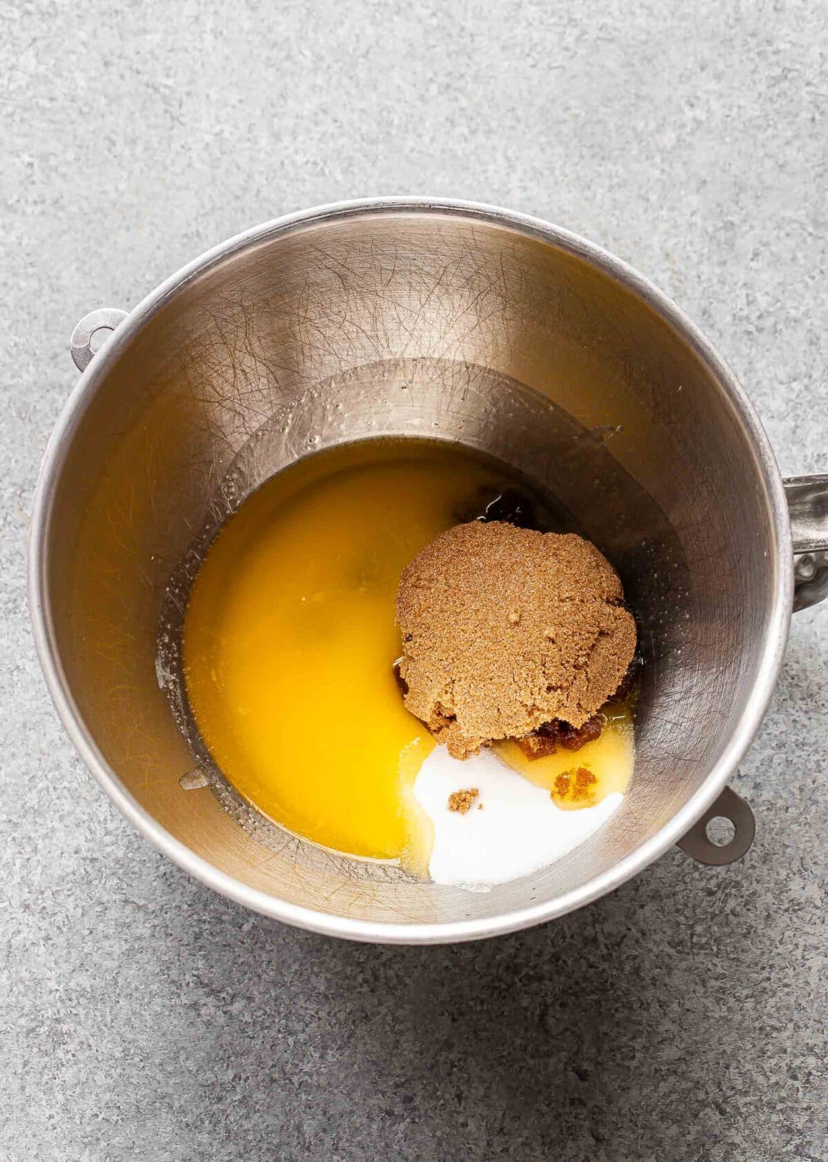 Melted butter and sugar in a mixing bowl.