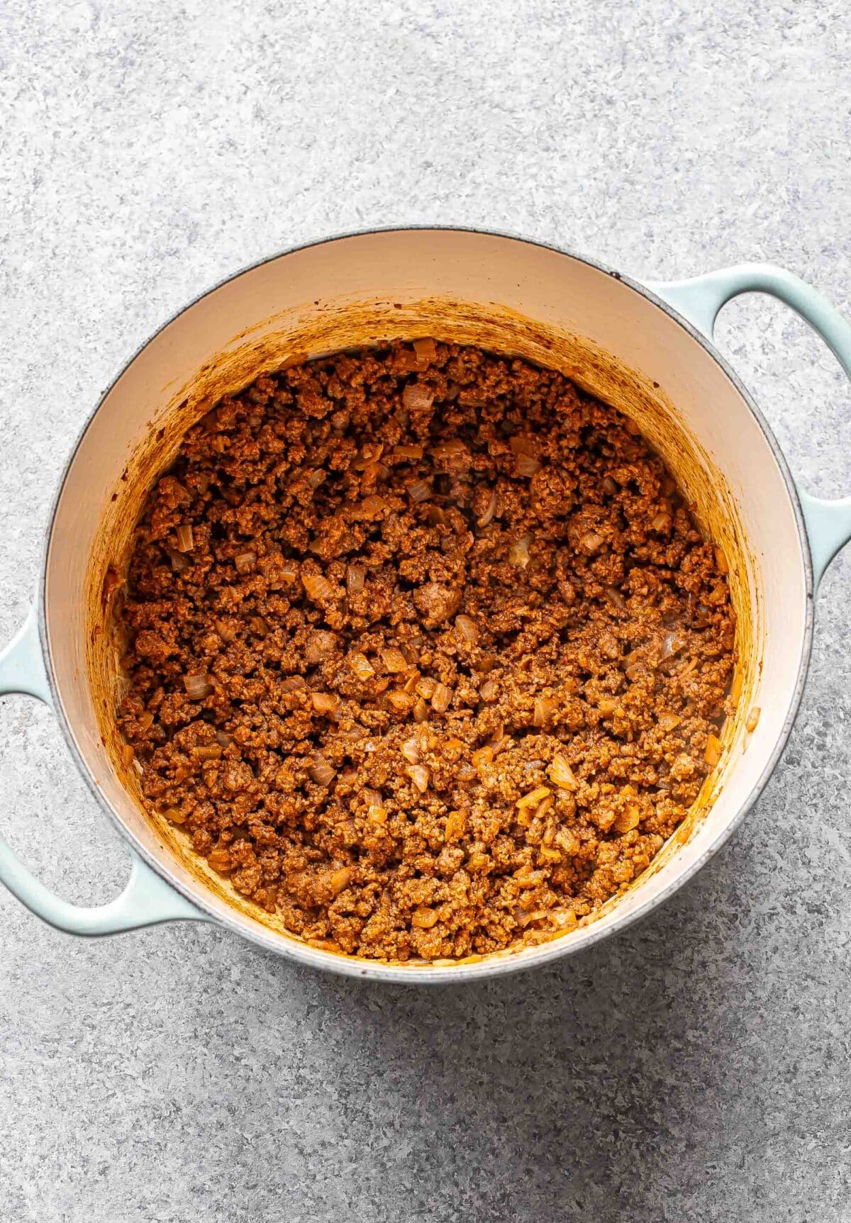 Ground beef mixture for hamburger helper in a pot.