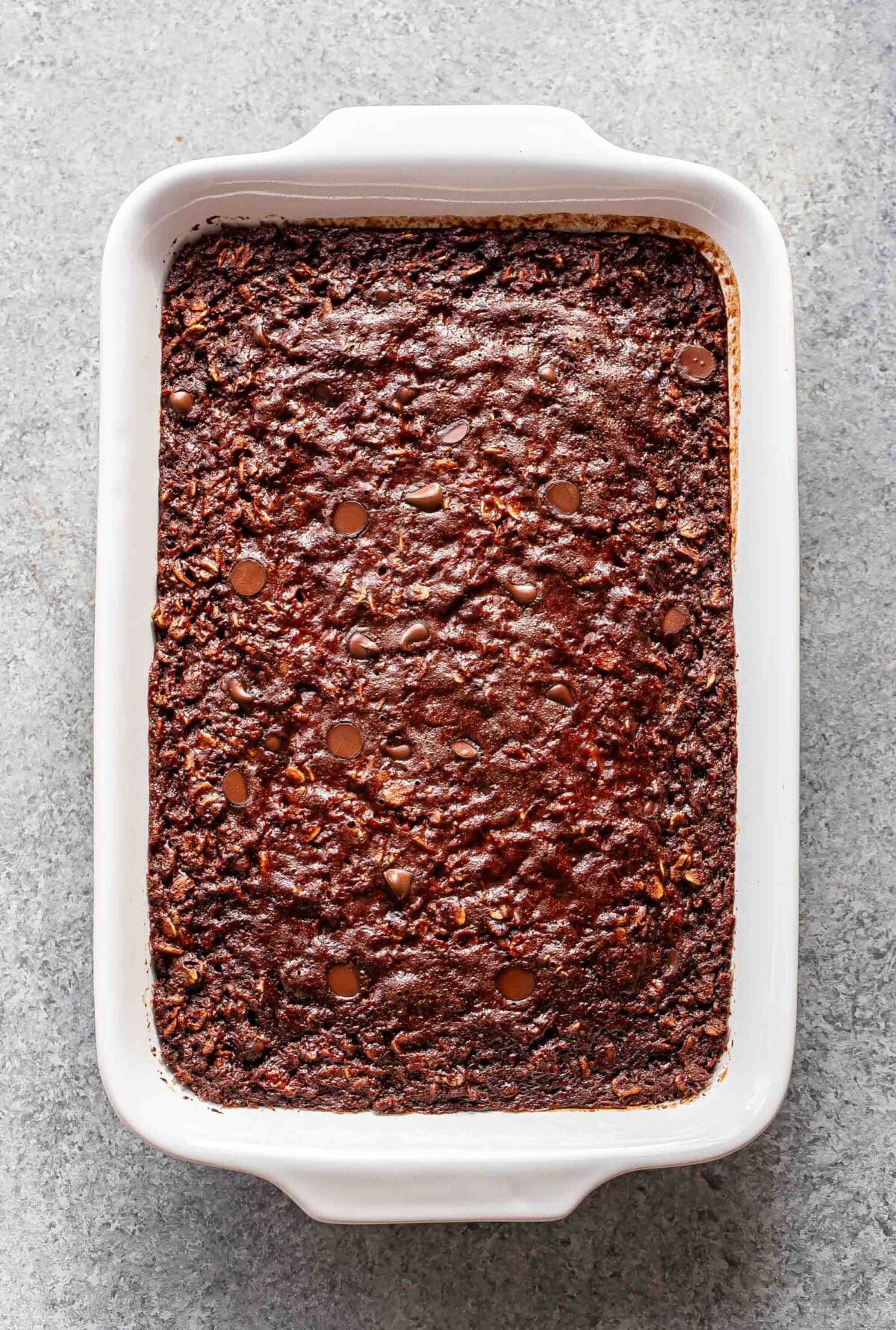 Chocolate baked oatmeal in a rectangular white baking dish.