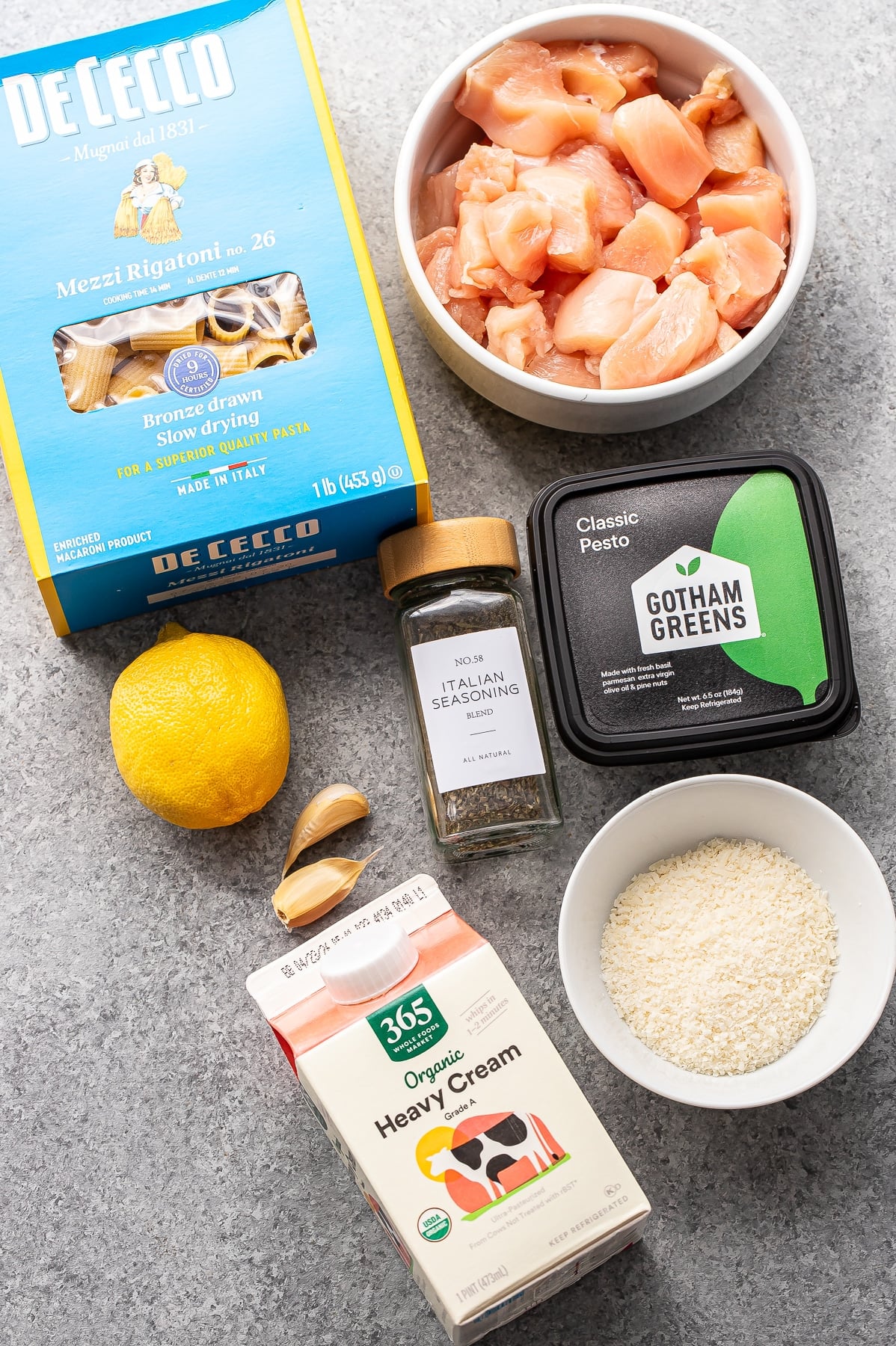 Ingredients used to make chicken and pesto pasta.