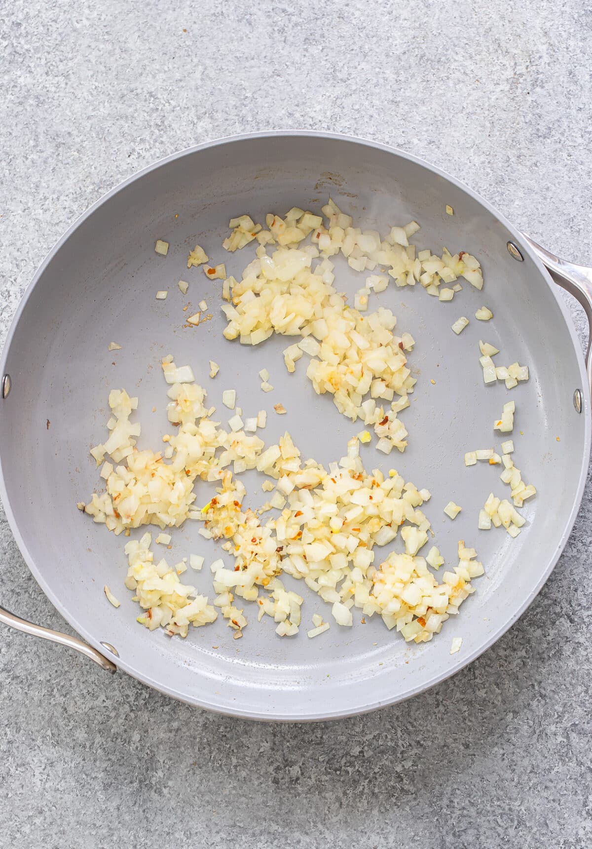 Cooked onions in a skillet.