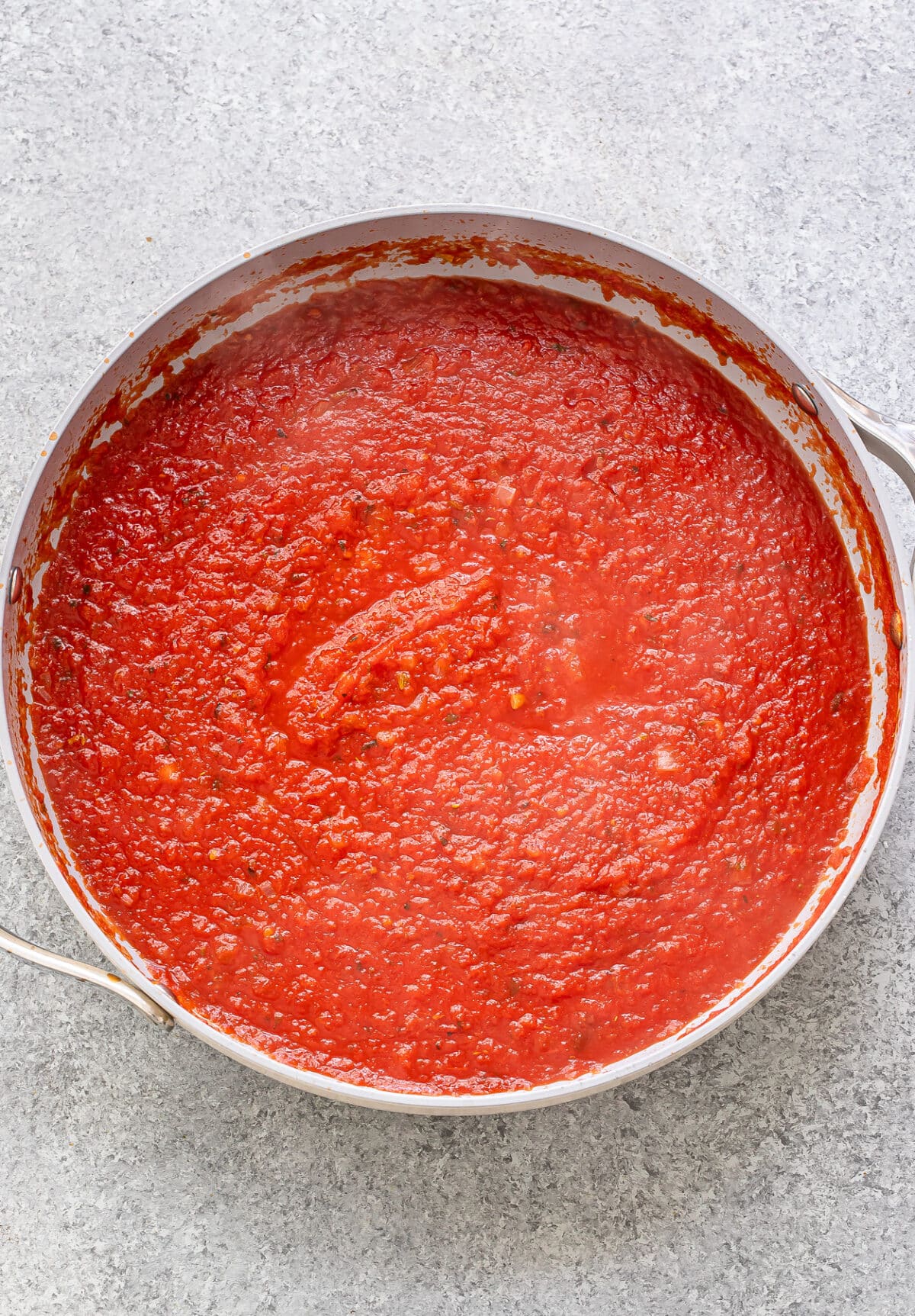 Vodka sauce in a skillet before the cream has been added.