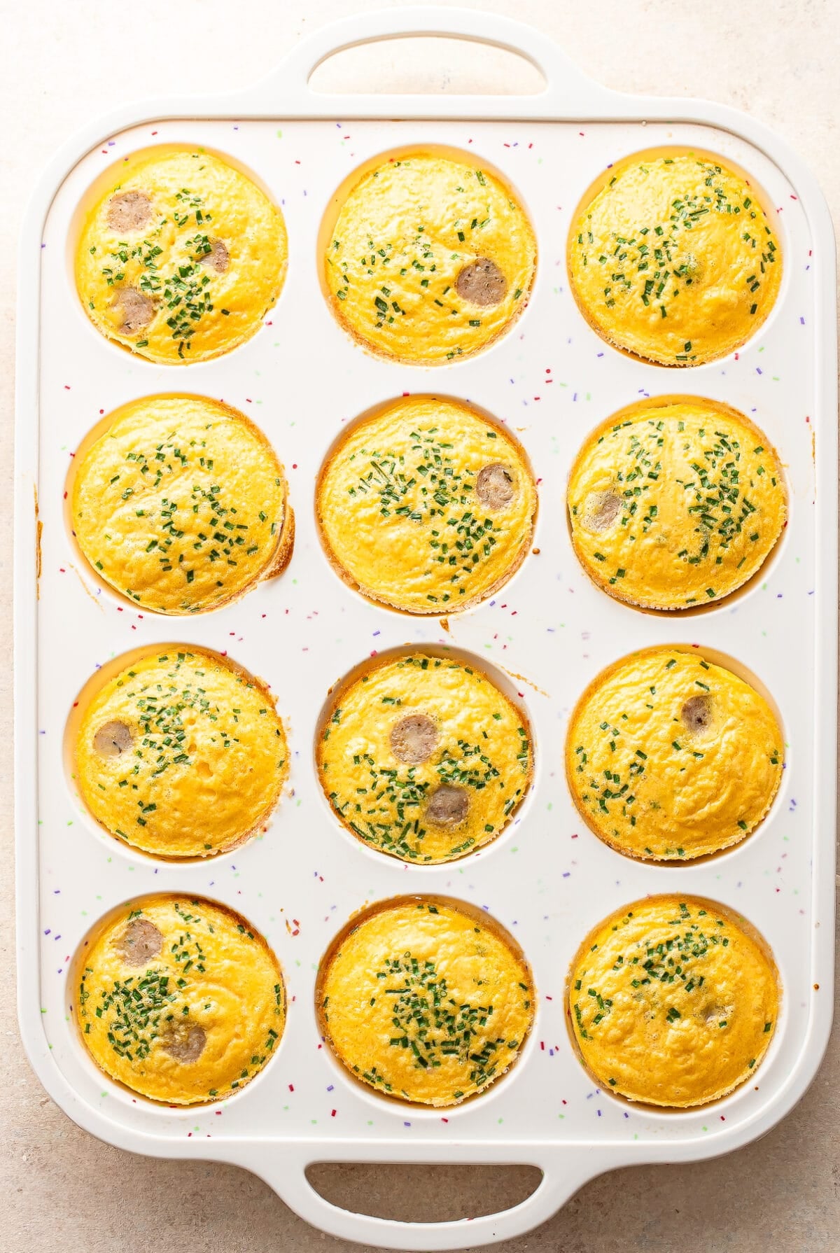 Baked cottage cheese egg bites in a silicone muffin pan.