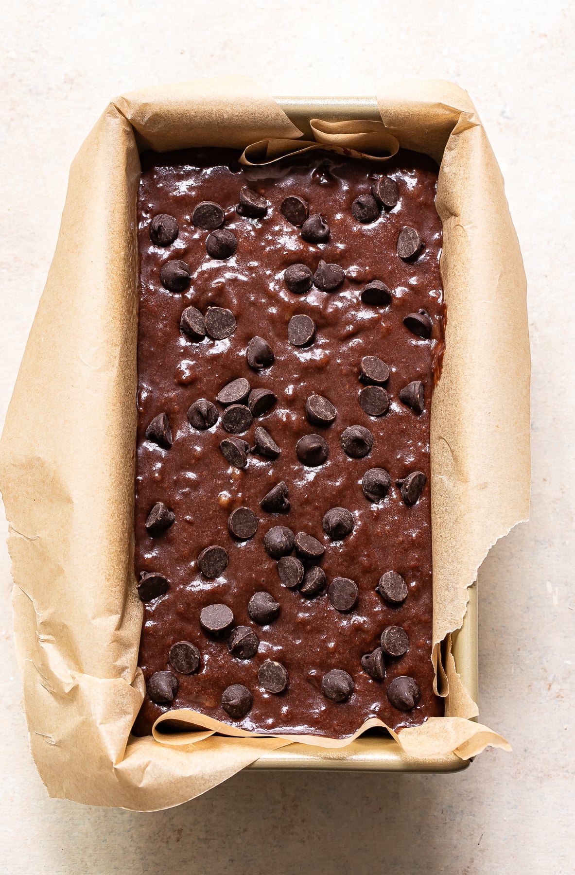 Unbaked chocolate chip banana bread in a loaf pan.
